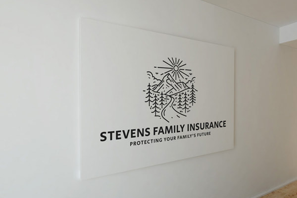 Stevens Family Insurance logo printed on the wall