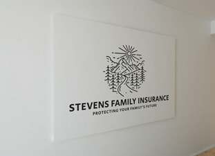 Stevens Family Insurance logo printed on the wall